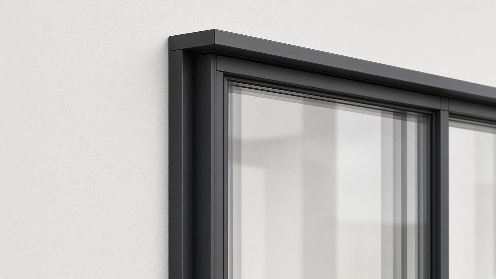 Black aluminum window in a light stucco wall